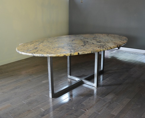 Oval Granite Top Dining Table and Six Beige Chairs