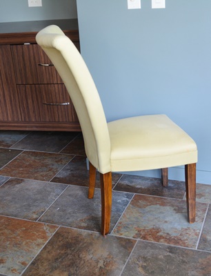 Oval Granite Top Dining Table and Six Beige Chairs