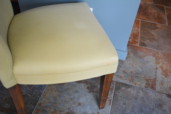 Oval Granite Top Dining Table and Six Beige Chairs