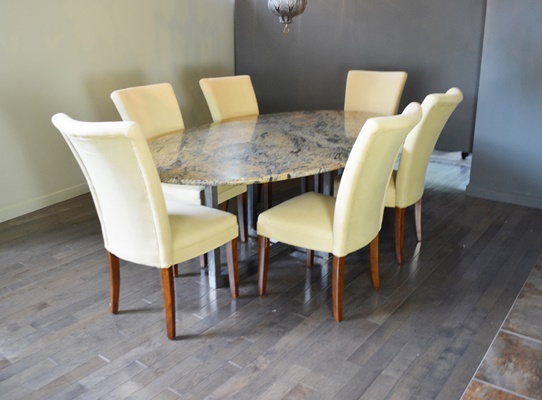 Oval Granite Top Dining Table and Six Beige Chairs