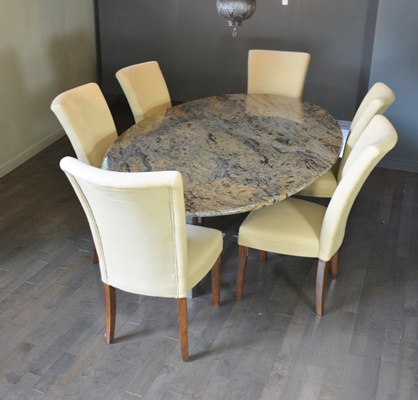 Oval Granite Top Dining Table and Six Beige Chairs