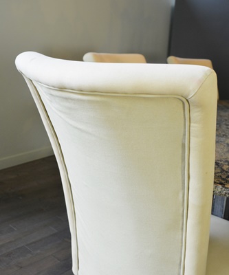Oval Granite Top Dining Table and Six Beige Chairs