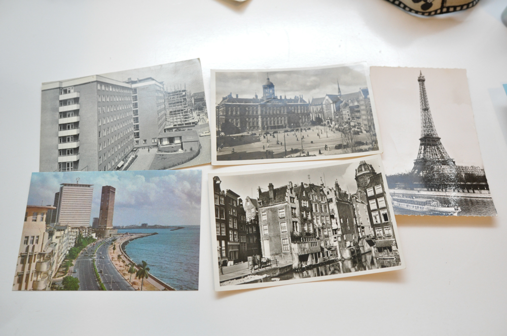 Vintage Travel Items Including Postcards of India and Disney Camera Strap