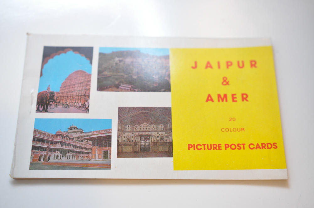 Vintage Travel Items Including Postcards of India and Disney Camera Strap