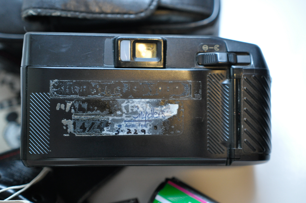 Vintage Travel Items Including Postcards of India and Disney Camera Strap