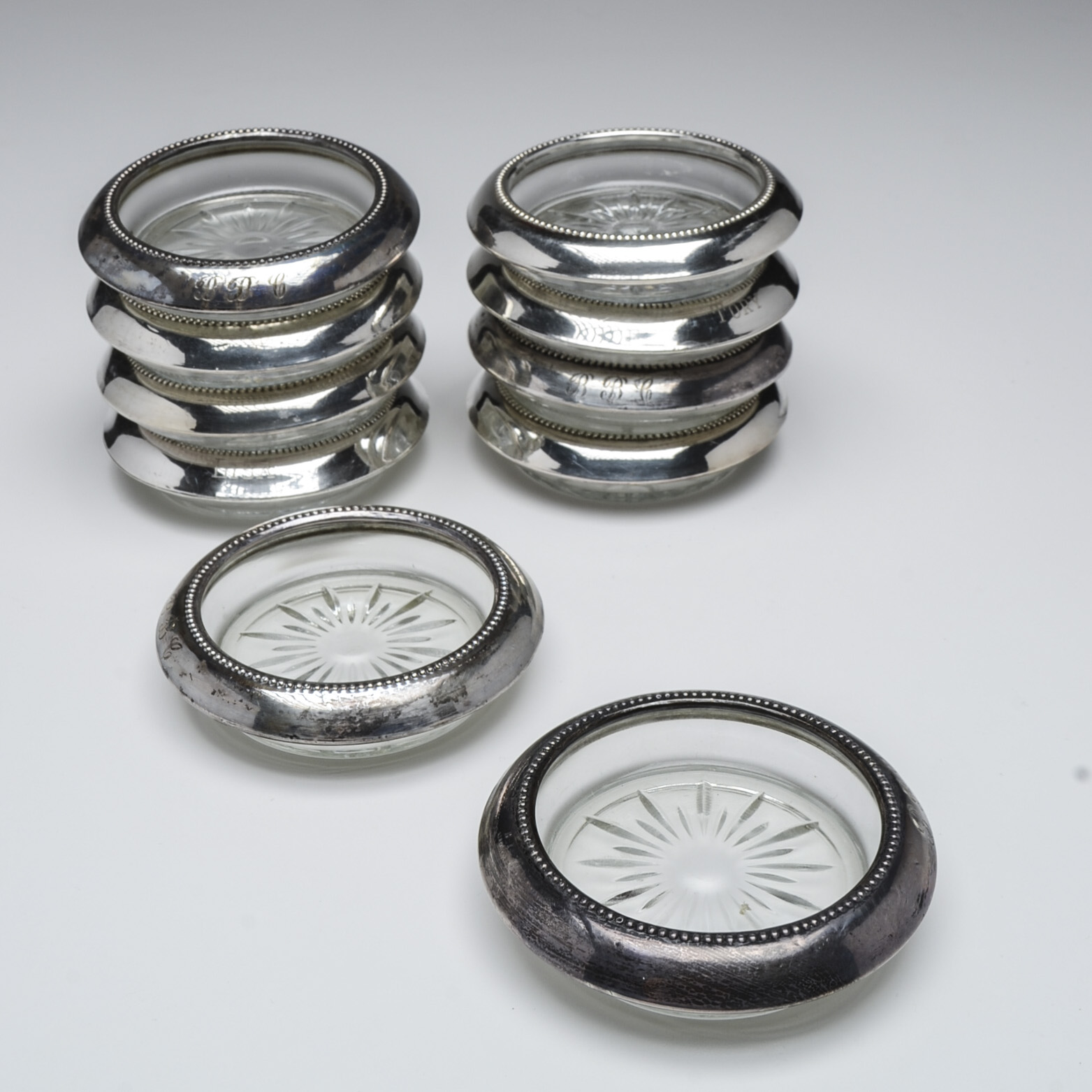 Ten Pressed Glass Coasters with Sterling Silver Rim