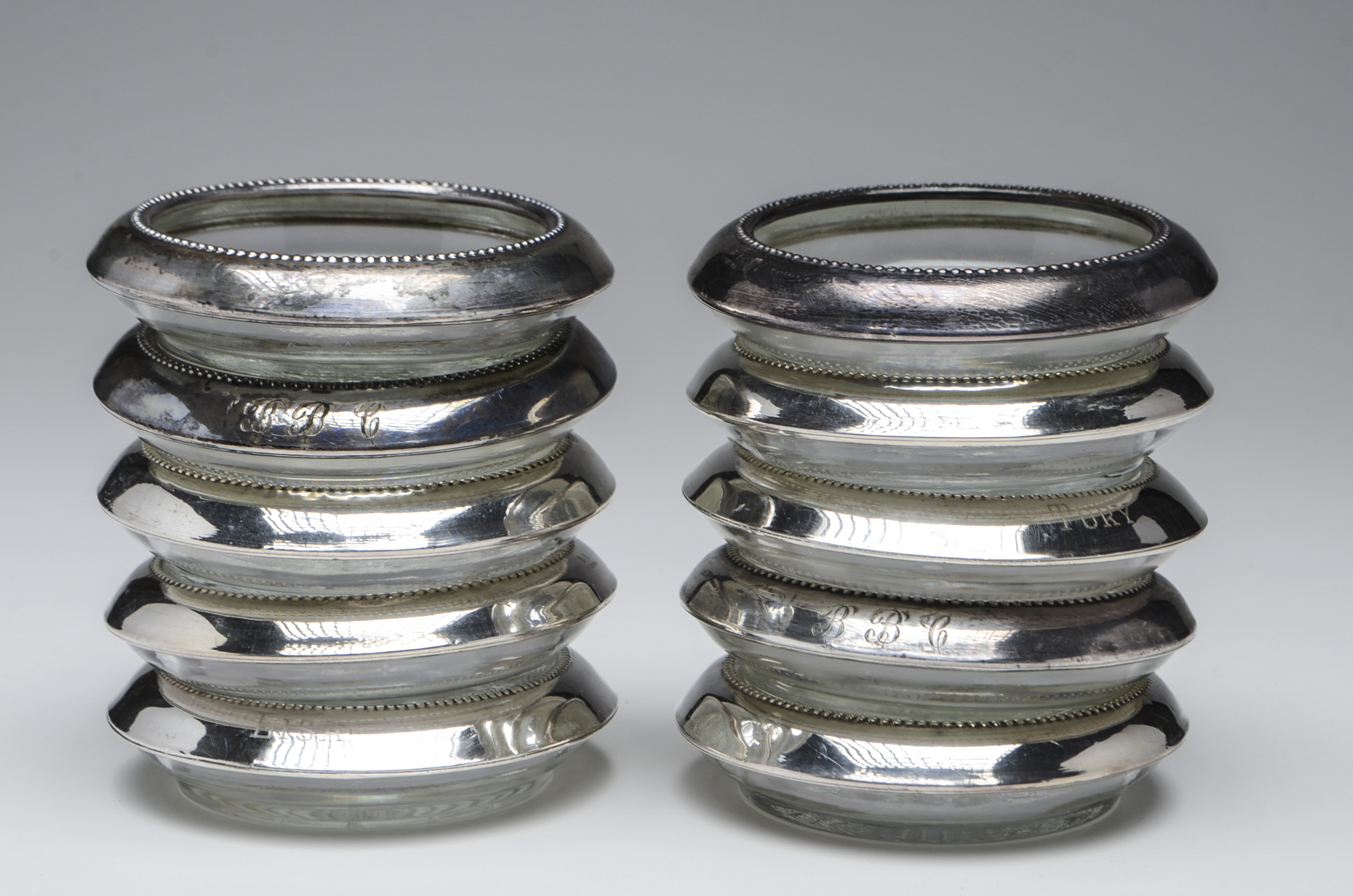 Ten Pressed Glass Coasters with Sterling Silver Rim