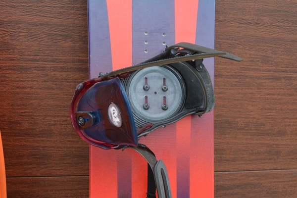 K2 Fat Bob Snow Board and Two Plastic Sleds