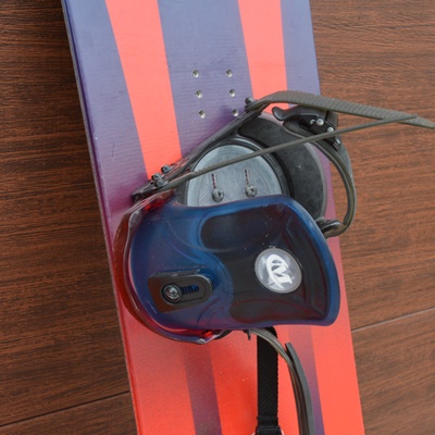 K2 Fat Bob Snow Board and Two Plastic Sleds