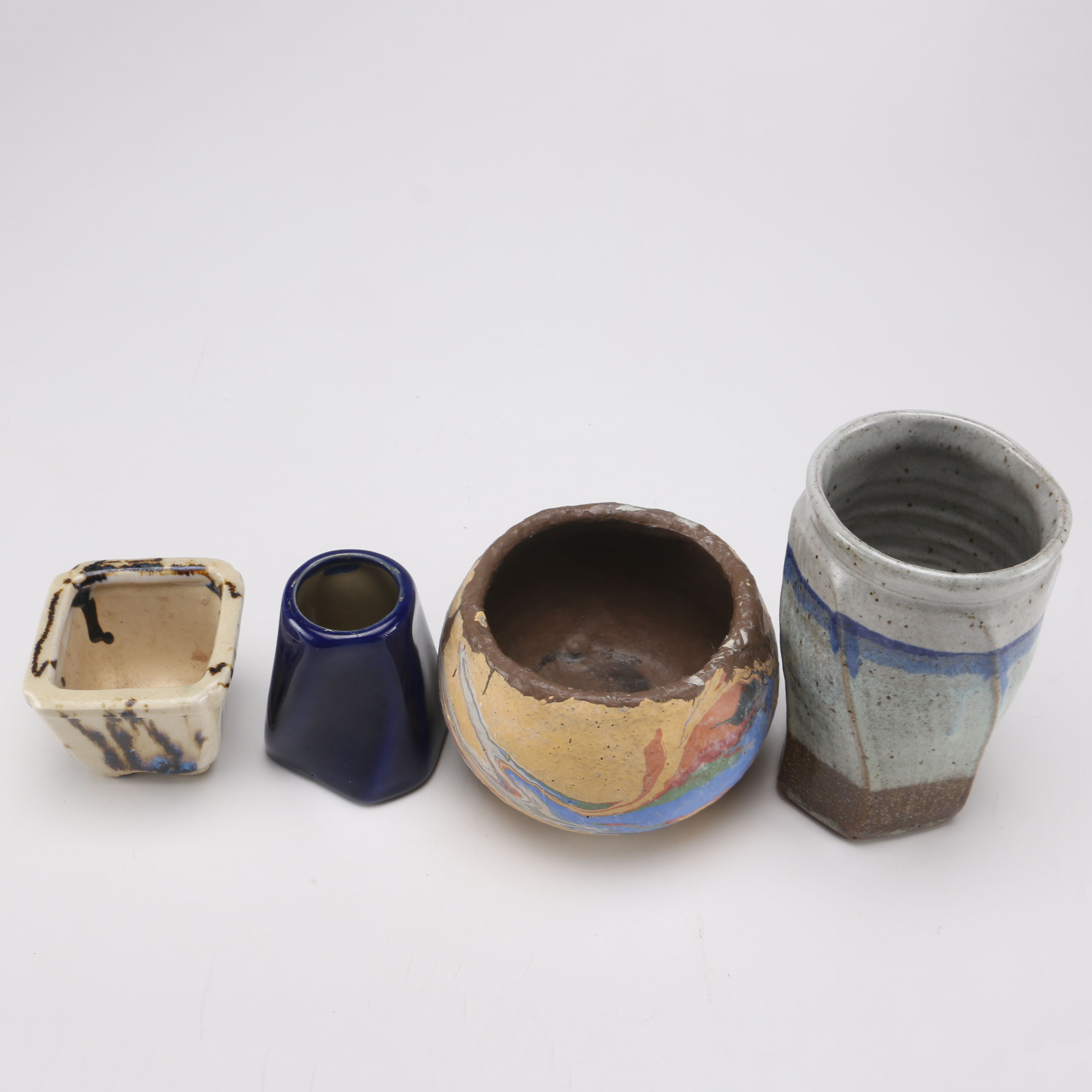 Assortment of Ceramic Bowls and Vases