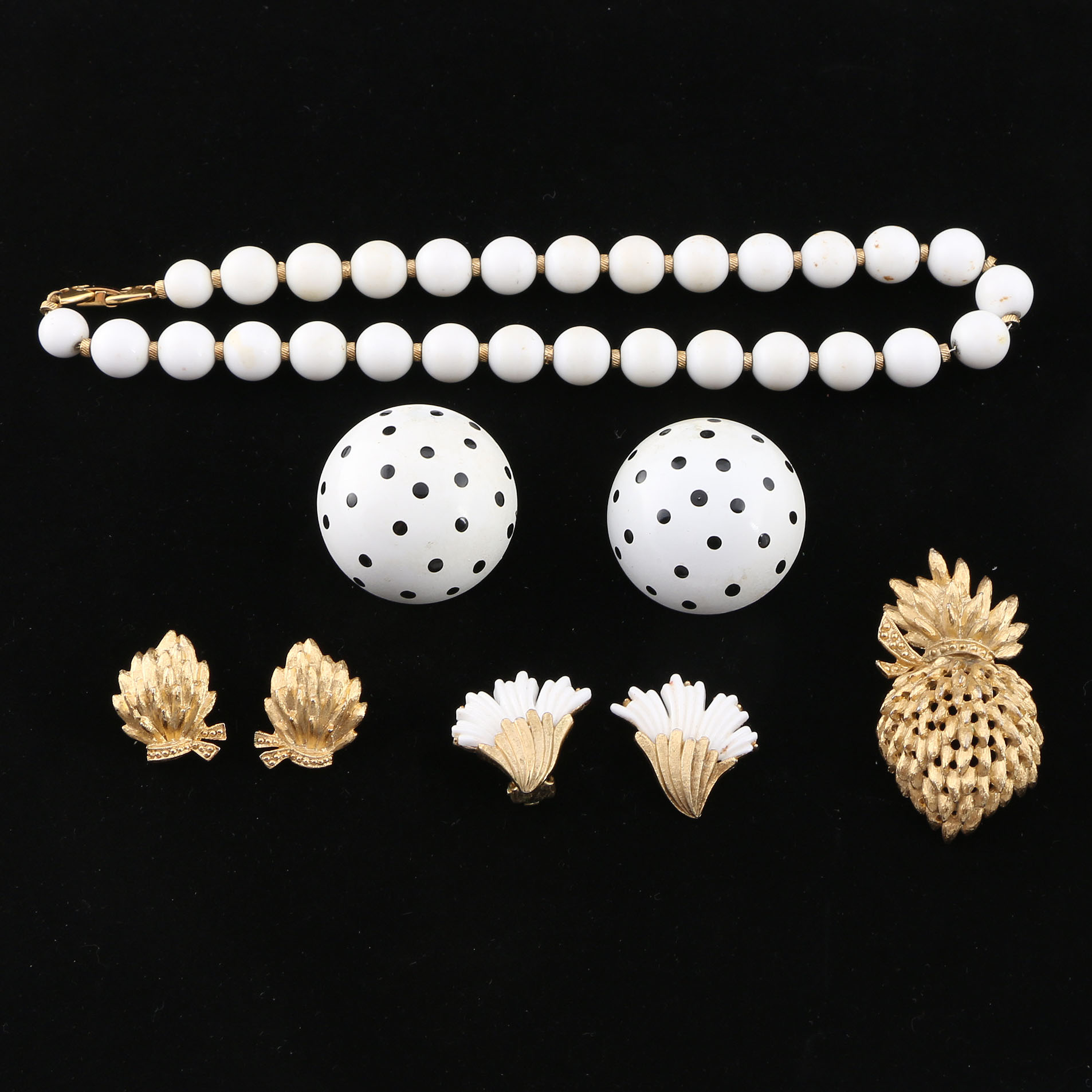 Collection of Black, White, and Gold Tone Jewelry