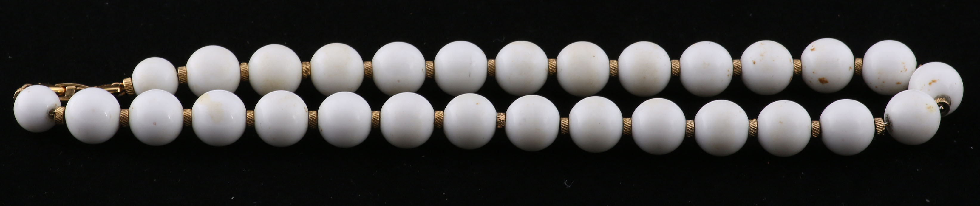 Collection of Black, White, and Gold Tone Jewelry