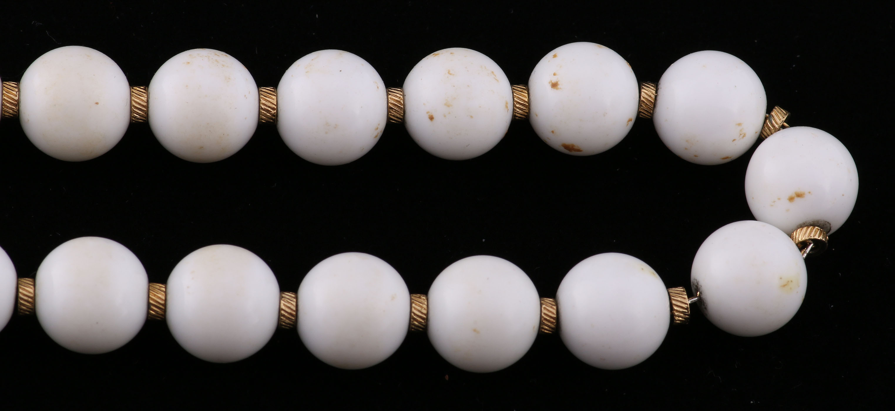 Collection of Black, White, and Gold Tone Jewelry