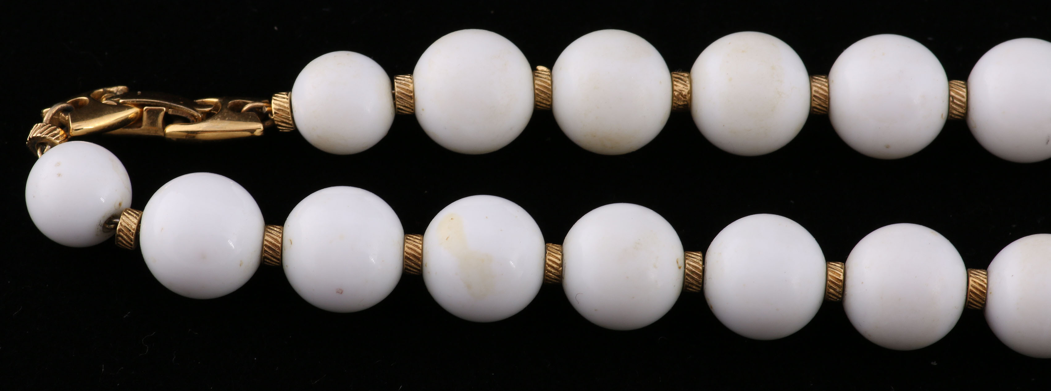 Collection of Black, White, and Gold Tone Jewelry