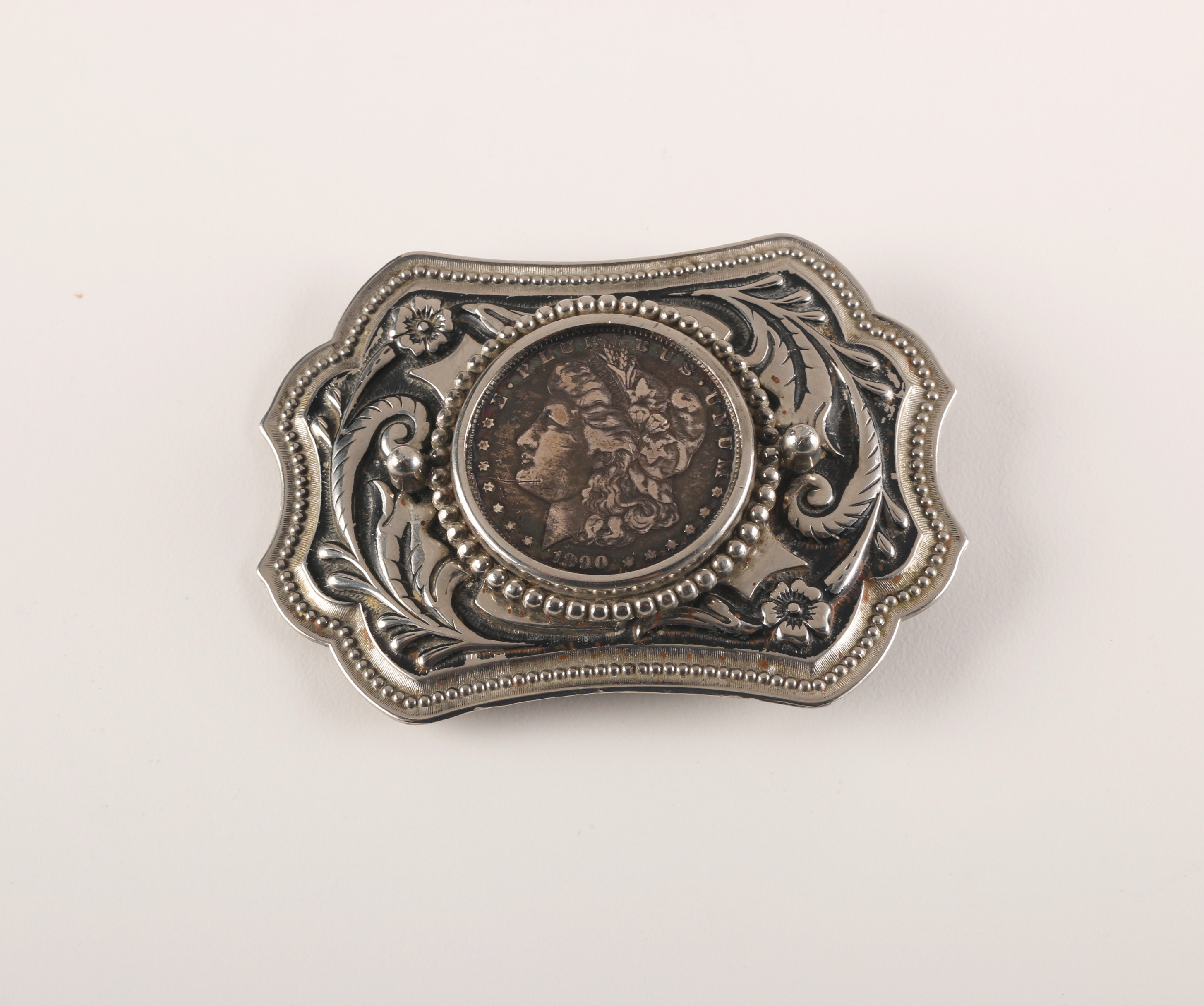 Pair of Coin Inlaid Belt Buckles