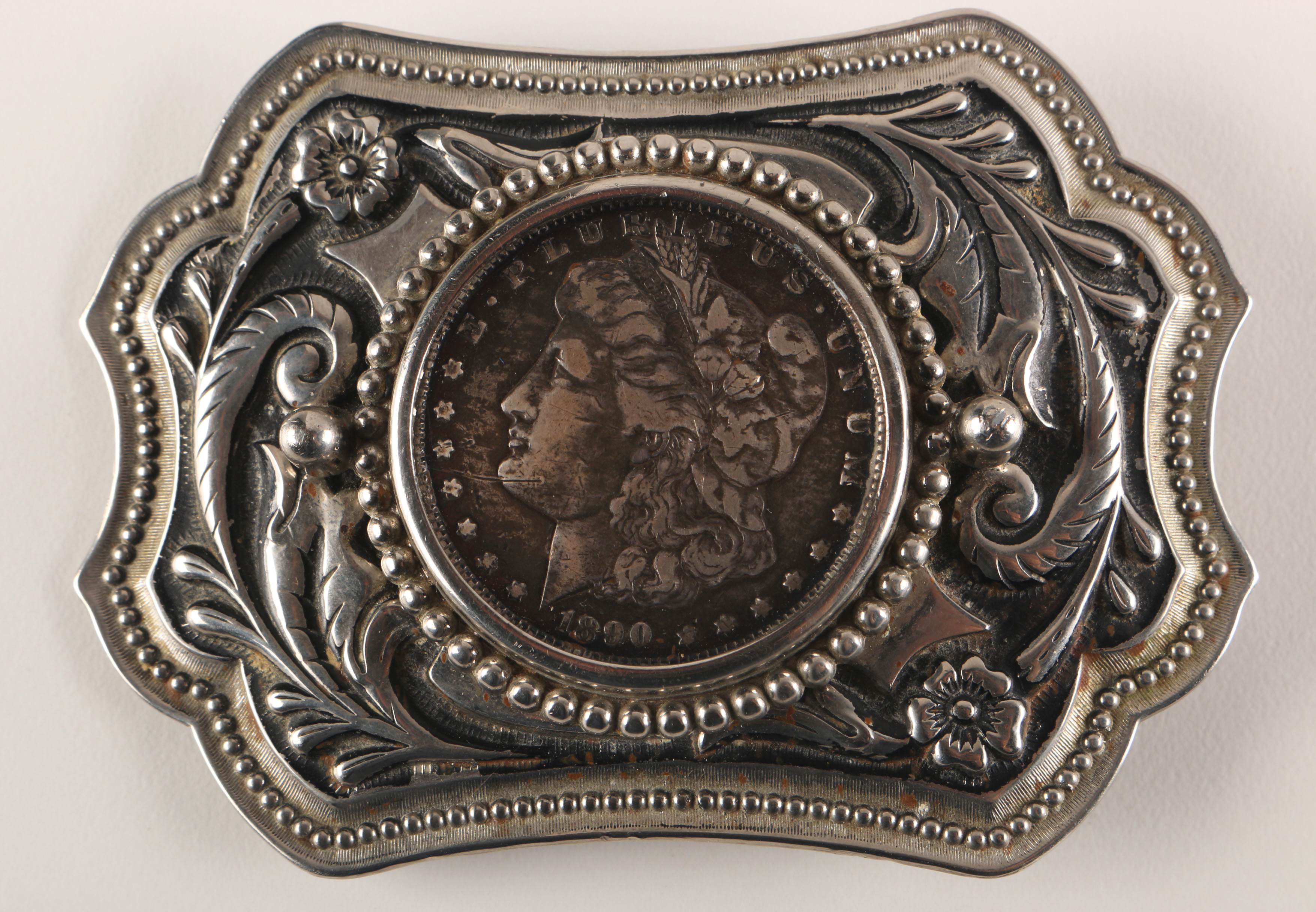 Pair of Coin Inlaid Belt Buckles
