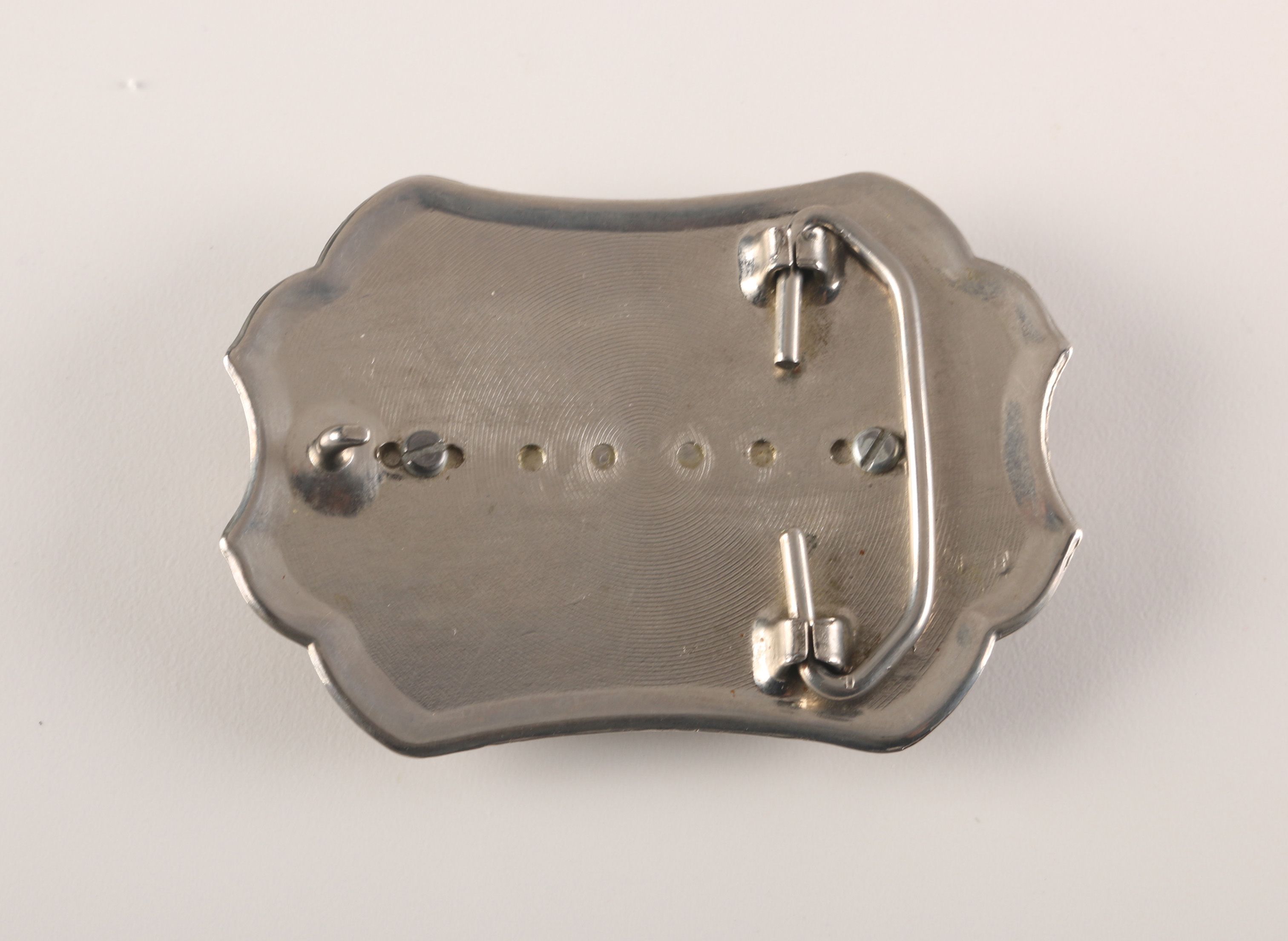 Pair of Coin Inlaid Belt Buckles