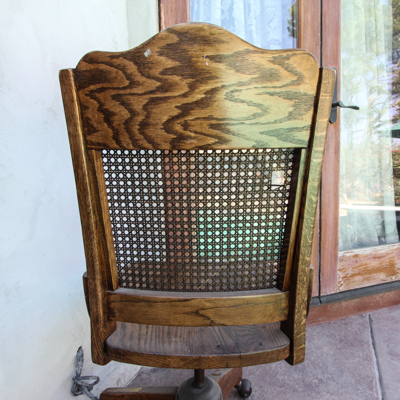 Vintage Rolling Chair with Cane Back