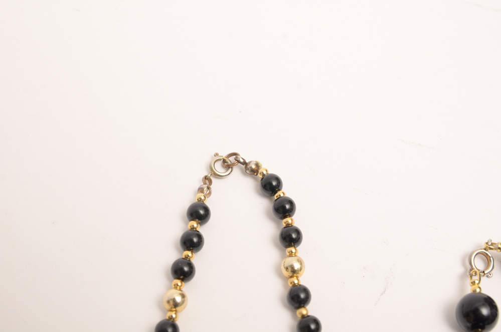 Collection of Carved Stone and Glass Bead Necklaces