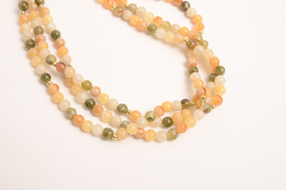 Collection of Carved Stone and Glass Bead Necklaces