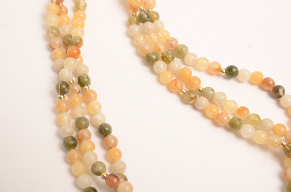 Collection of Carved Stone and Glass Bead Necklaces