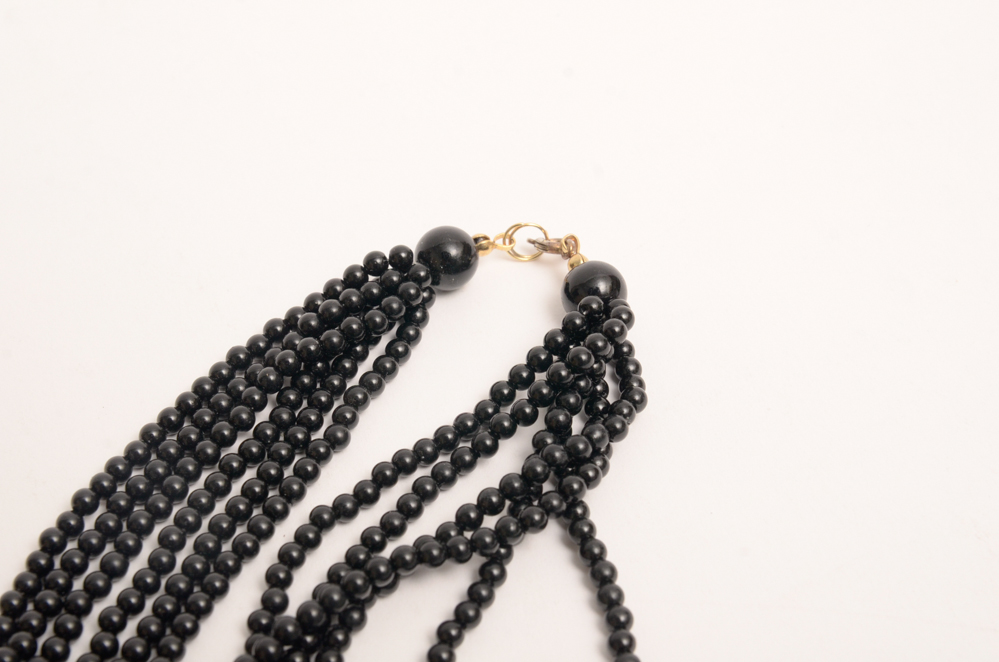 Collection of Carved Stone and Glass Bead Necklaces