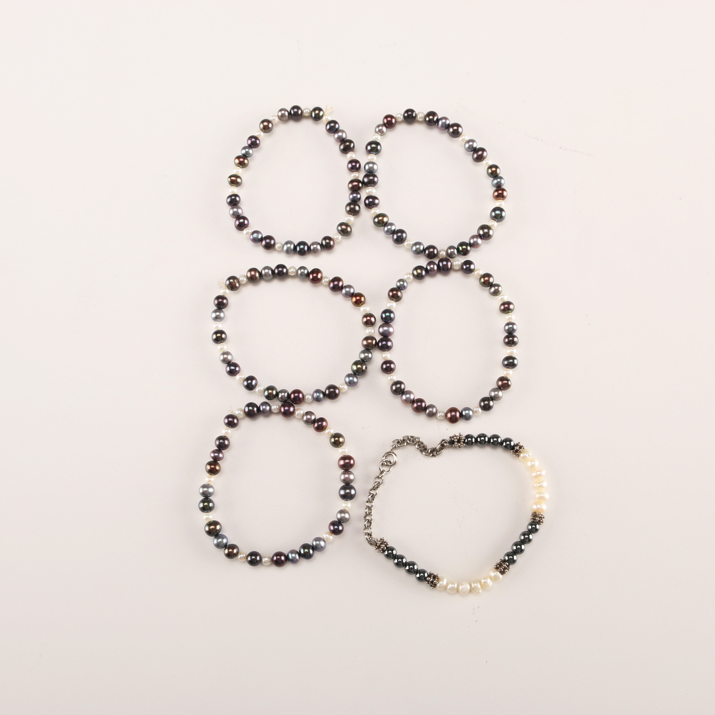 Collection of Bracelets with Pearl Like Beads