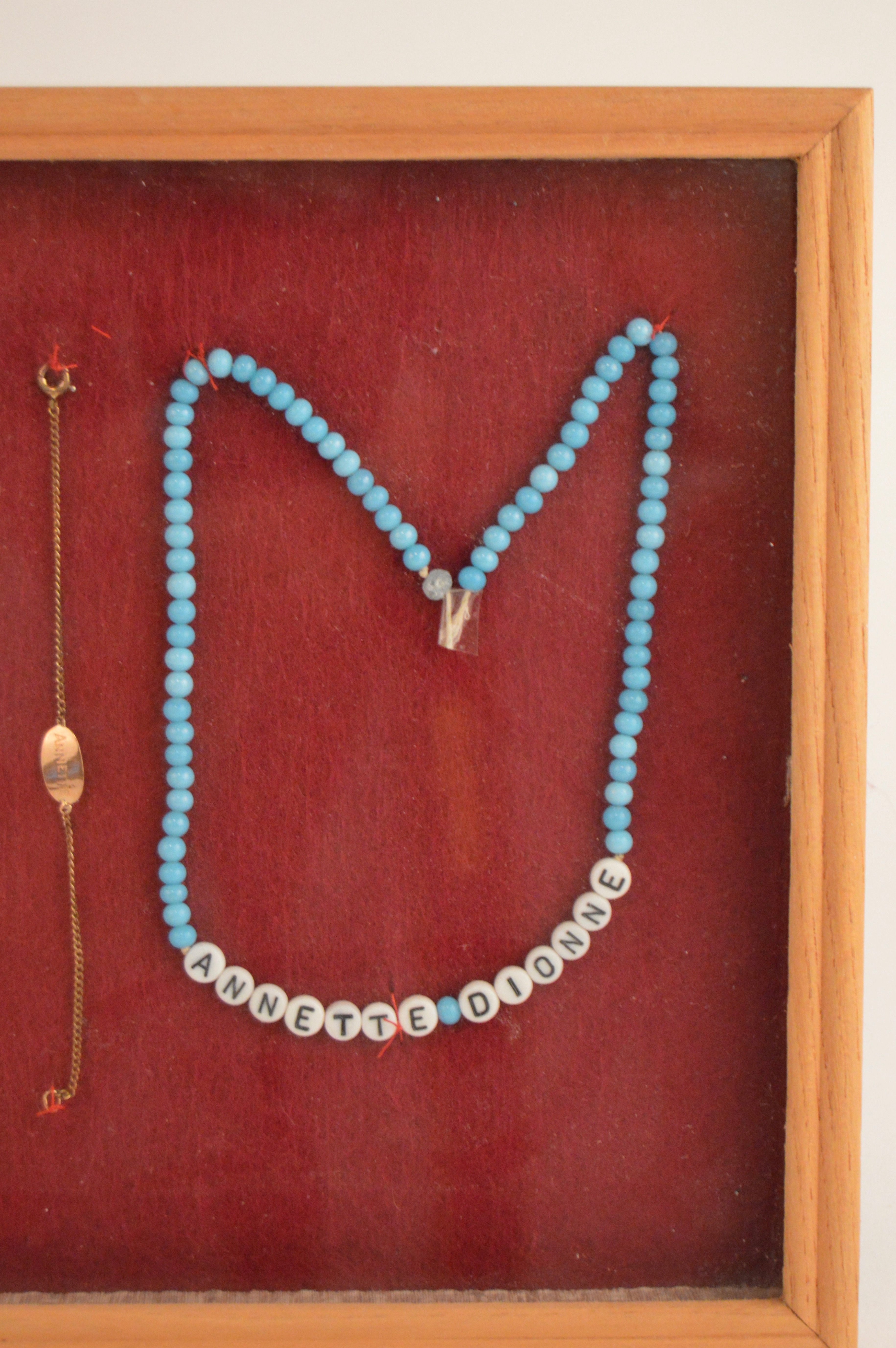 Framed Presentation of Annette Dionne Reproduction Baby Jewelry