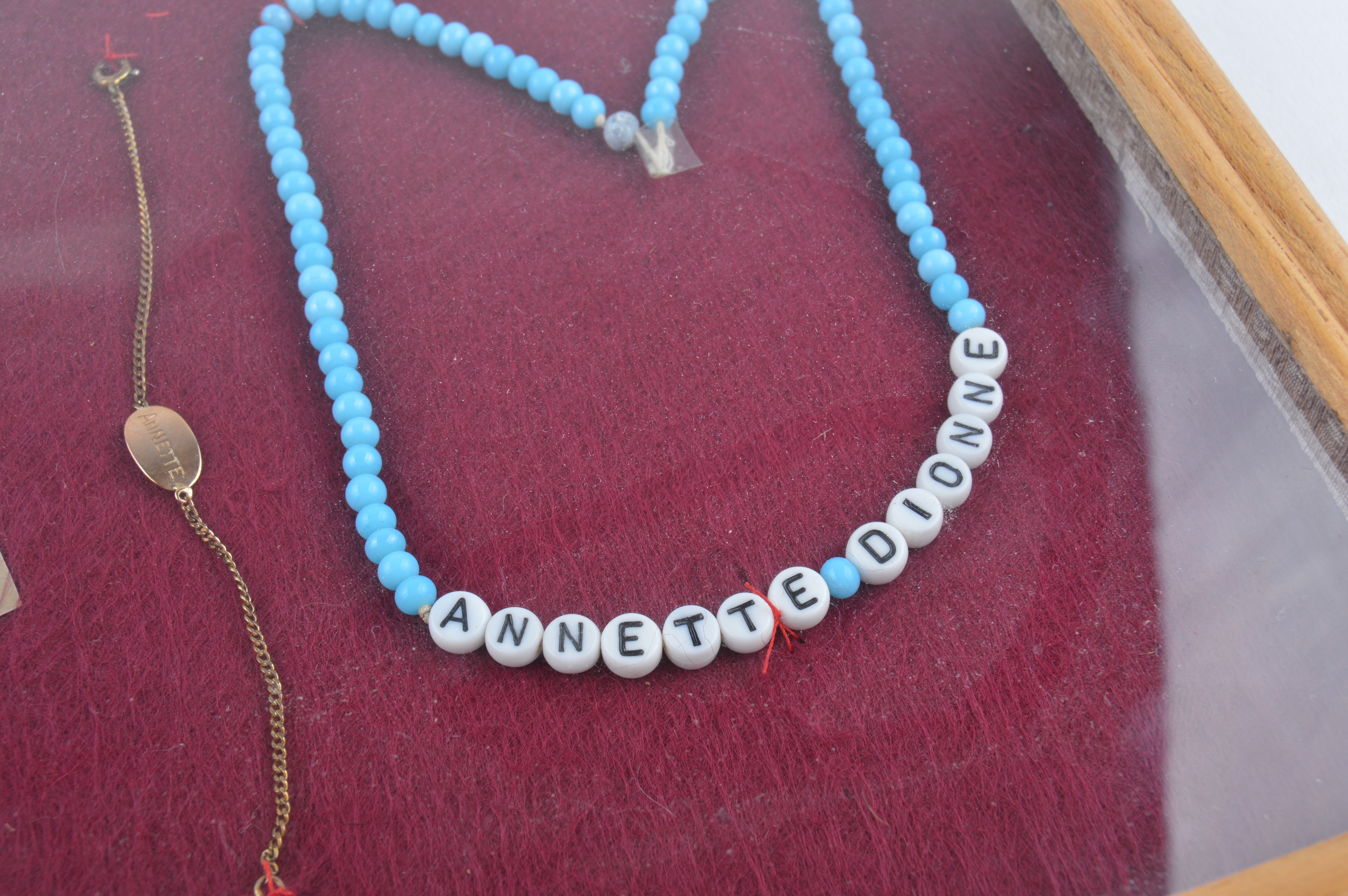 Framed Presentation of Annette Dionne Reproduction Baby Jewelry