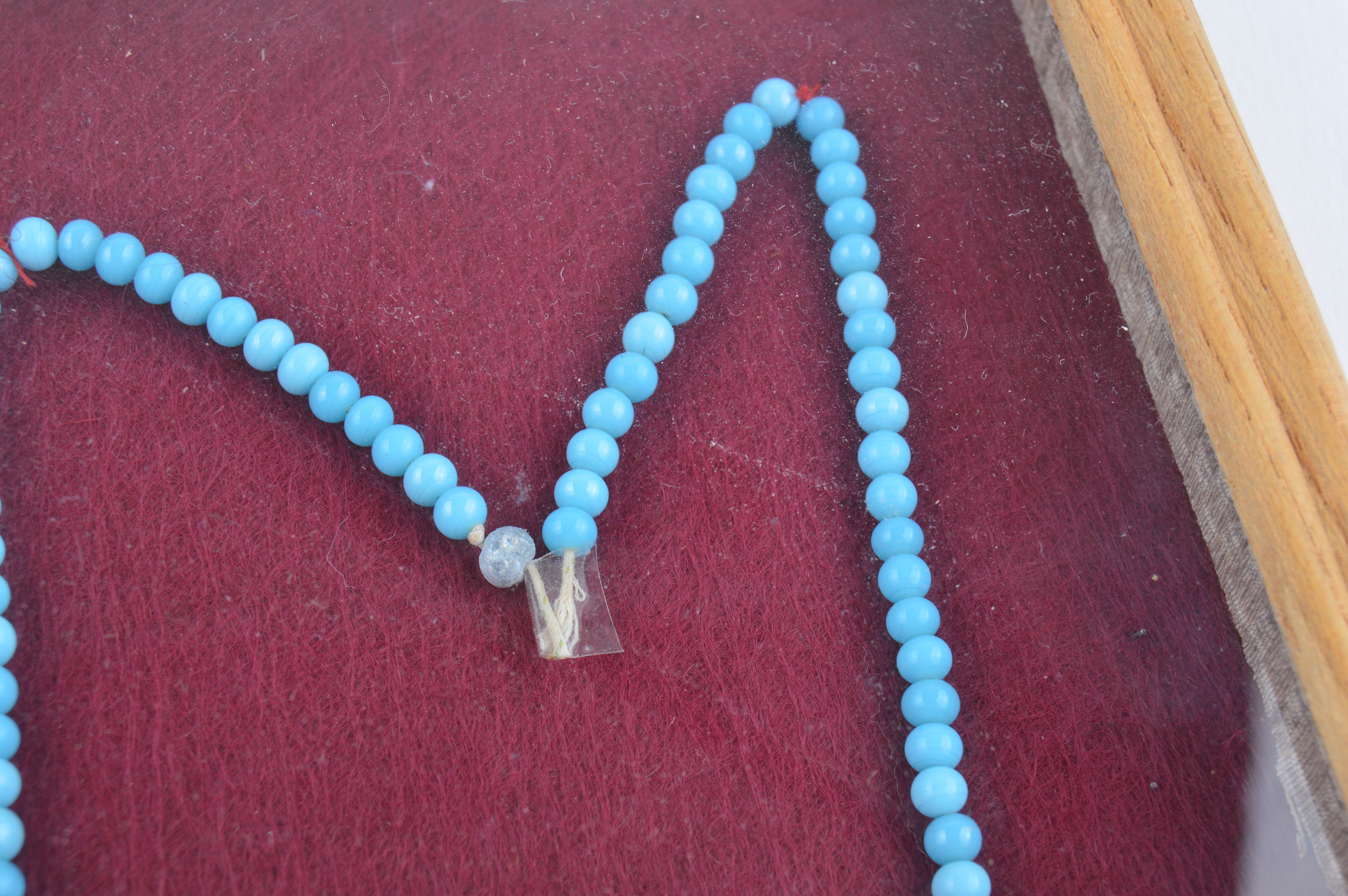 Framed Presentation of Annette Dionne Reproduction Baby Jewelry