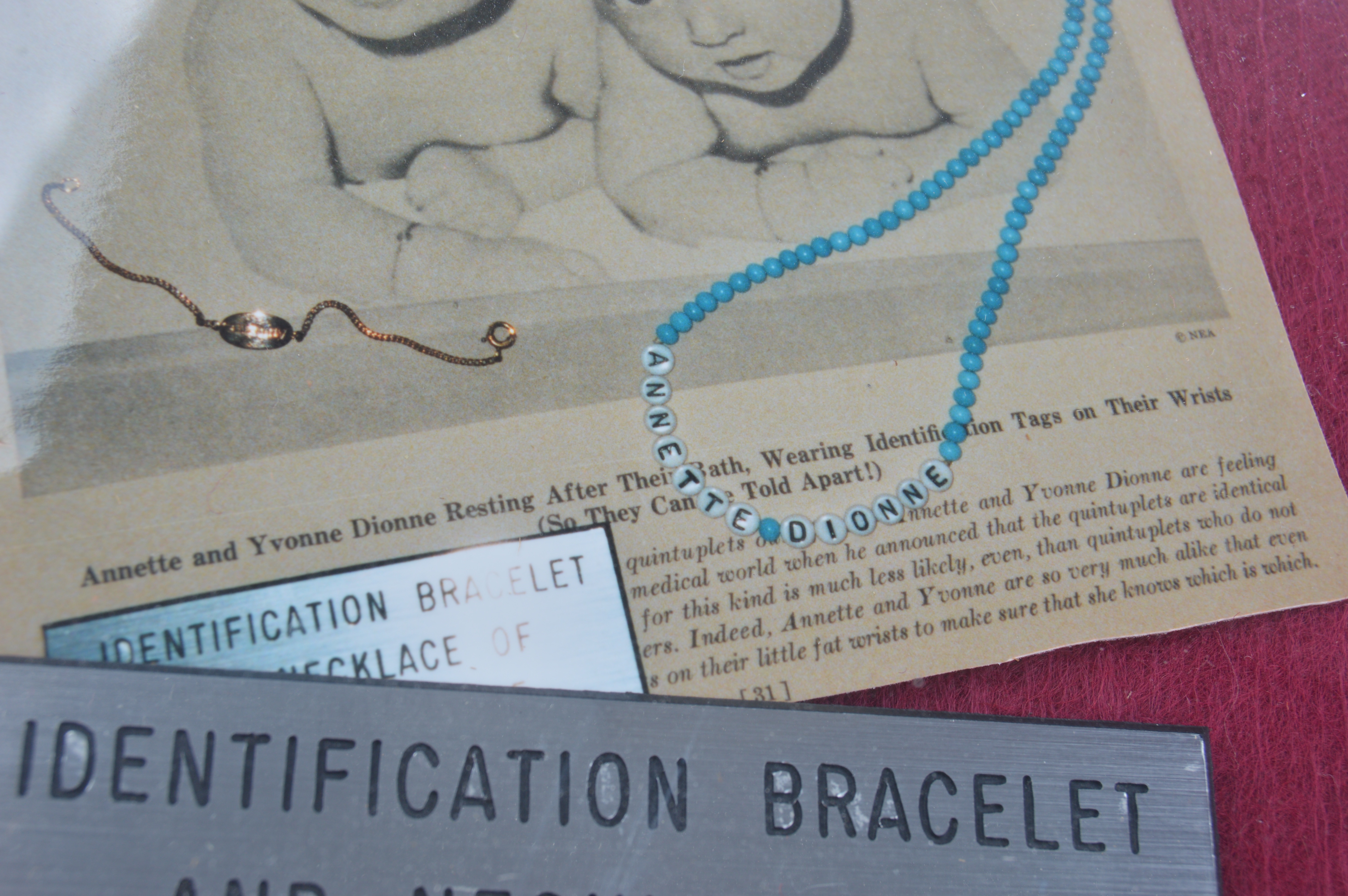 Framed Presentation of Annette Dionne Reproduction Baby Jewelry