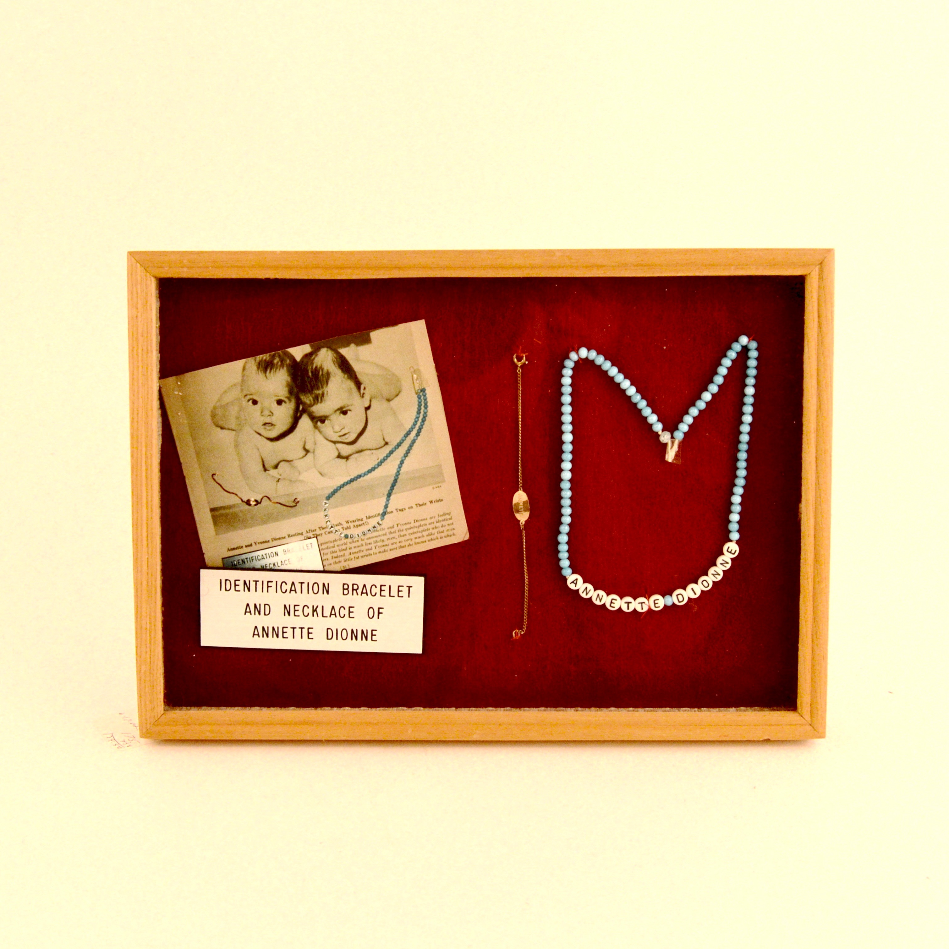 Framed Presentation of Annette Dionne Reproduction Baby Jewelry