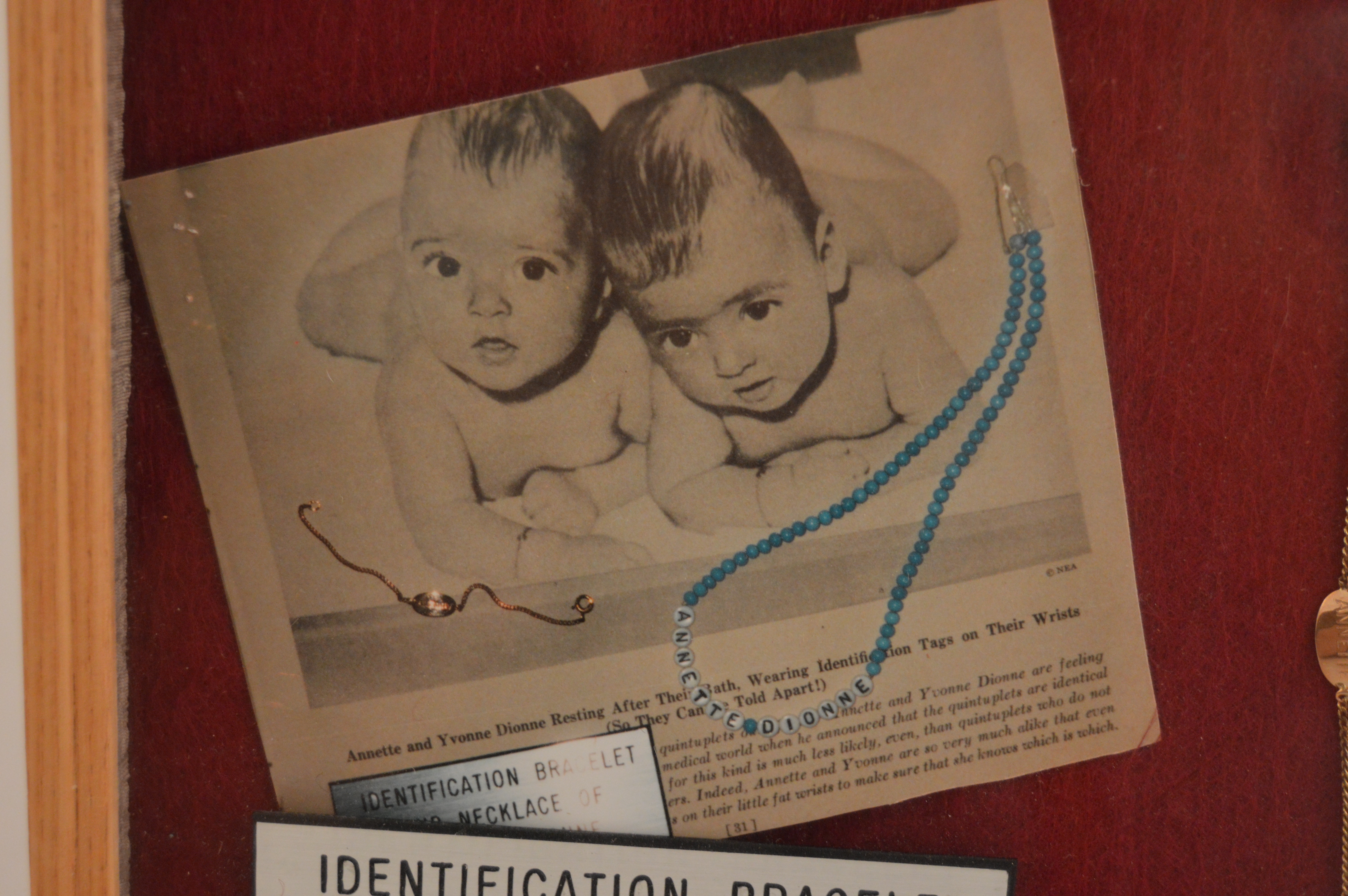 Framed Presentation of Annette Dionne Reproduction Baby Jewelry
