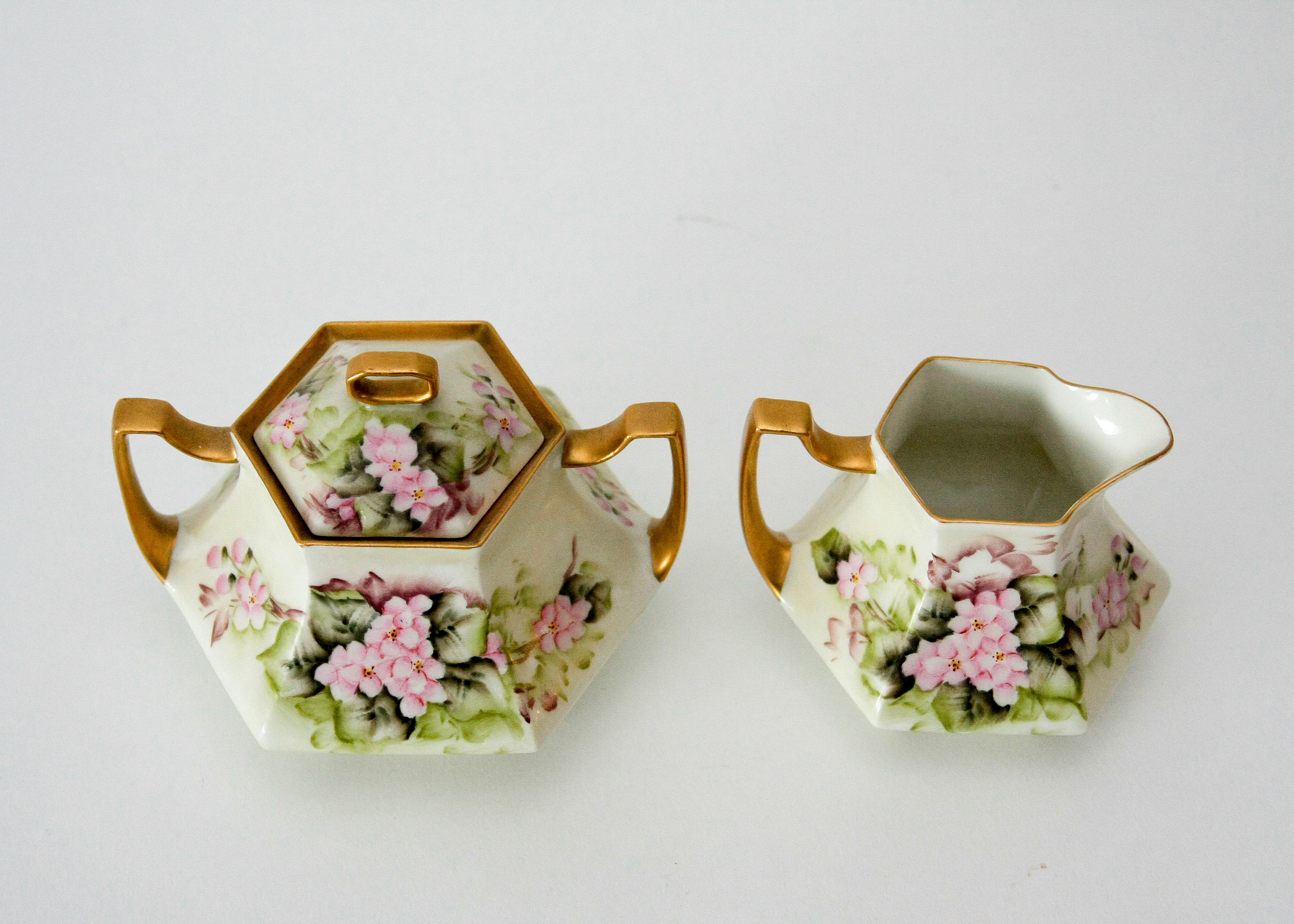 Assortment of Cups with a Cream and Sugar Set featuring Haviland