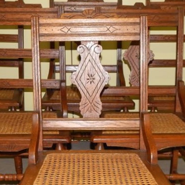 Six Eastlake Victorian Carved Cane Seat Chairs