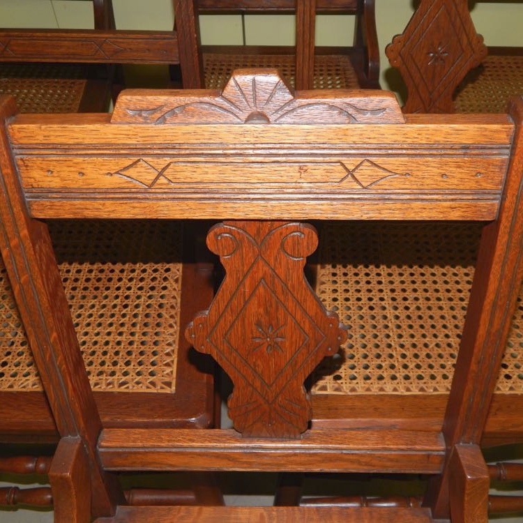 Six Eastlake Victorian Carved Cane Seat Chairs