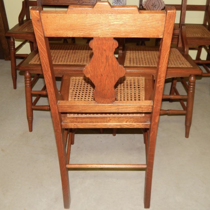 Six Eastlake Victorian Carved Cane Seat Chairs