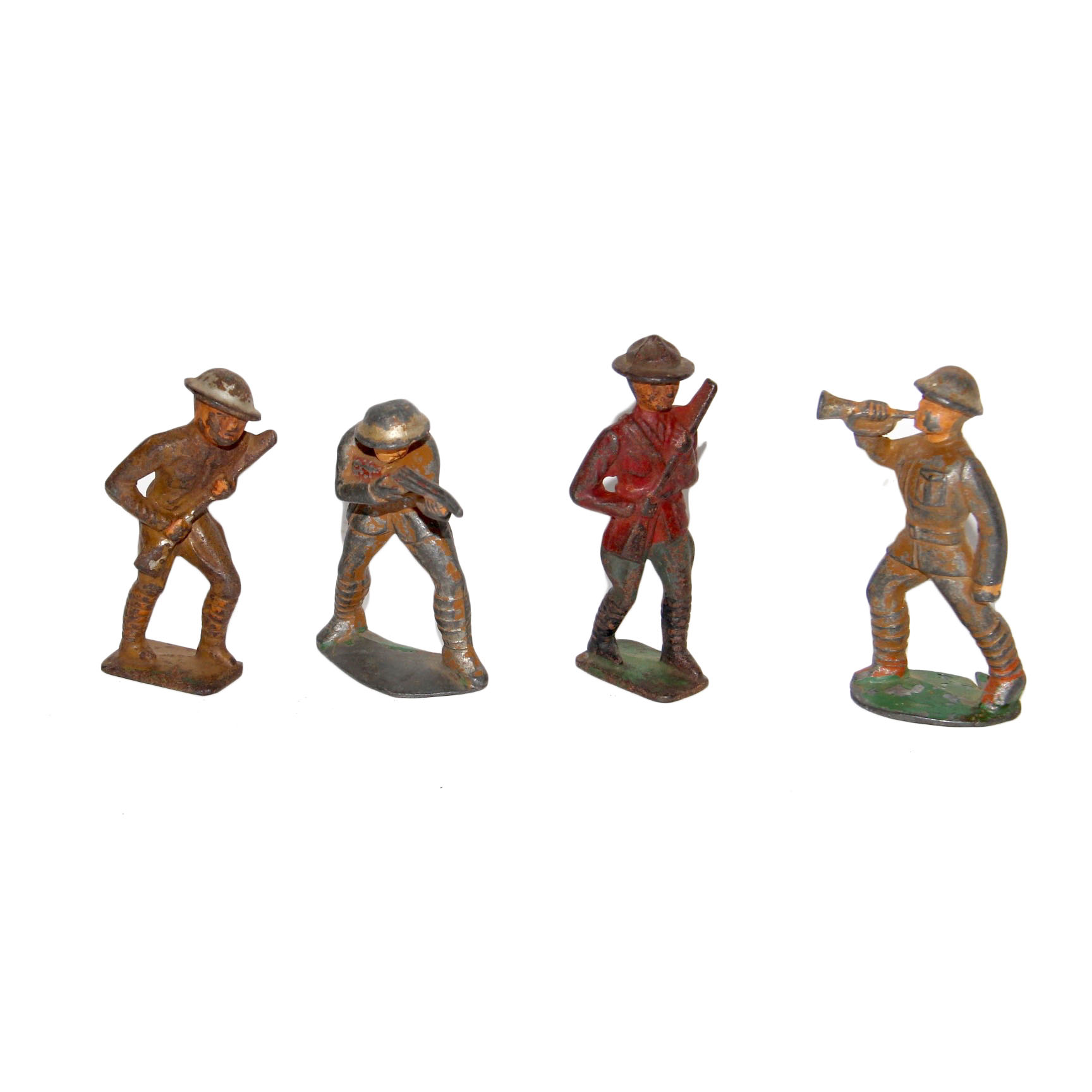 Four Vintage Metal Toy Soldiers