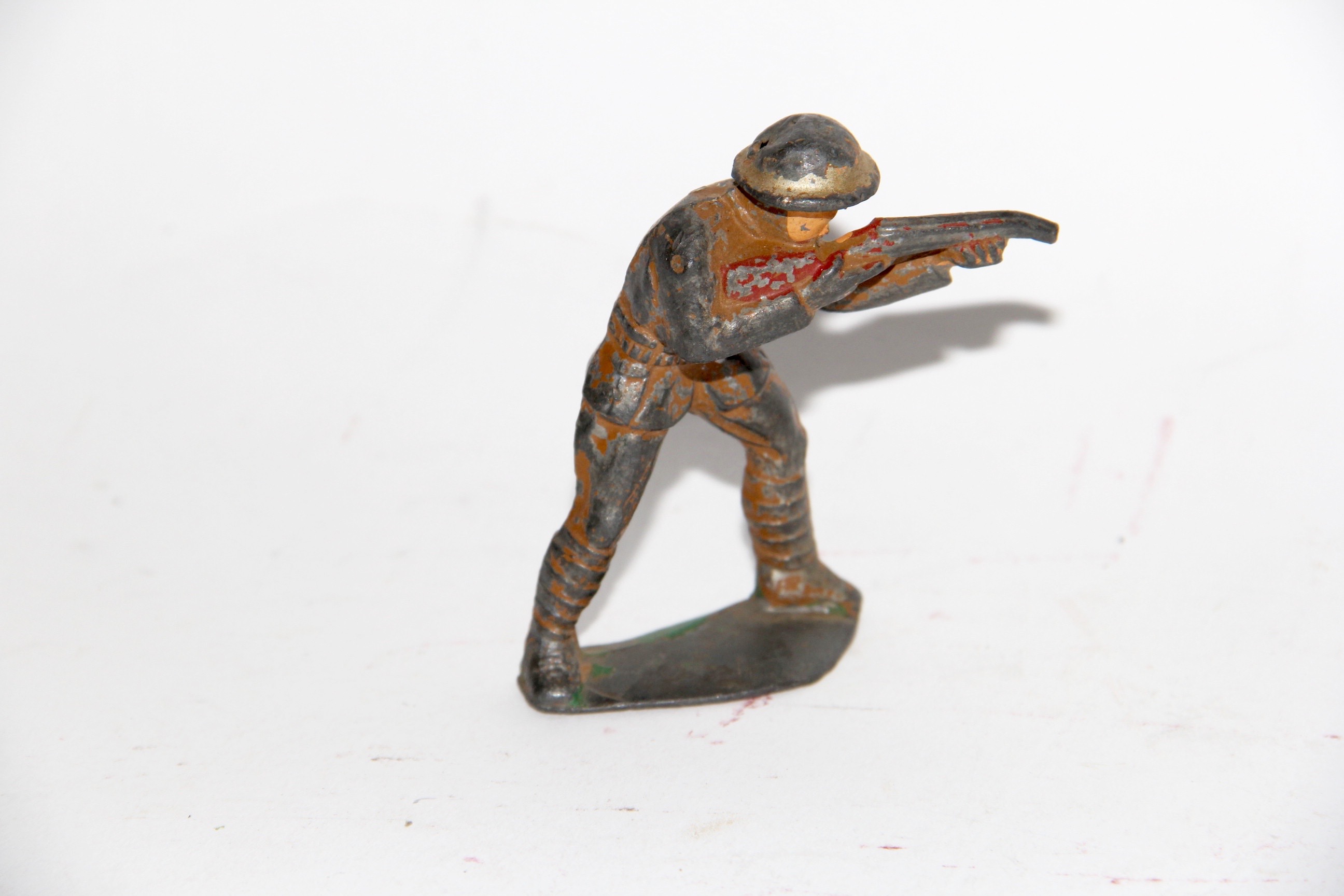 Four Vintage Metal Toy Soldiers