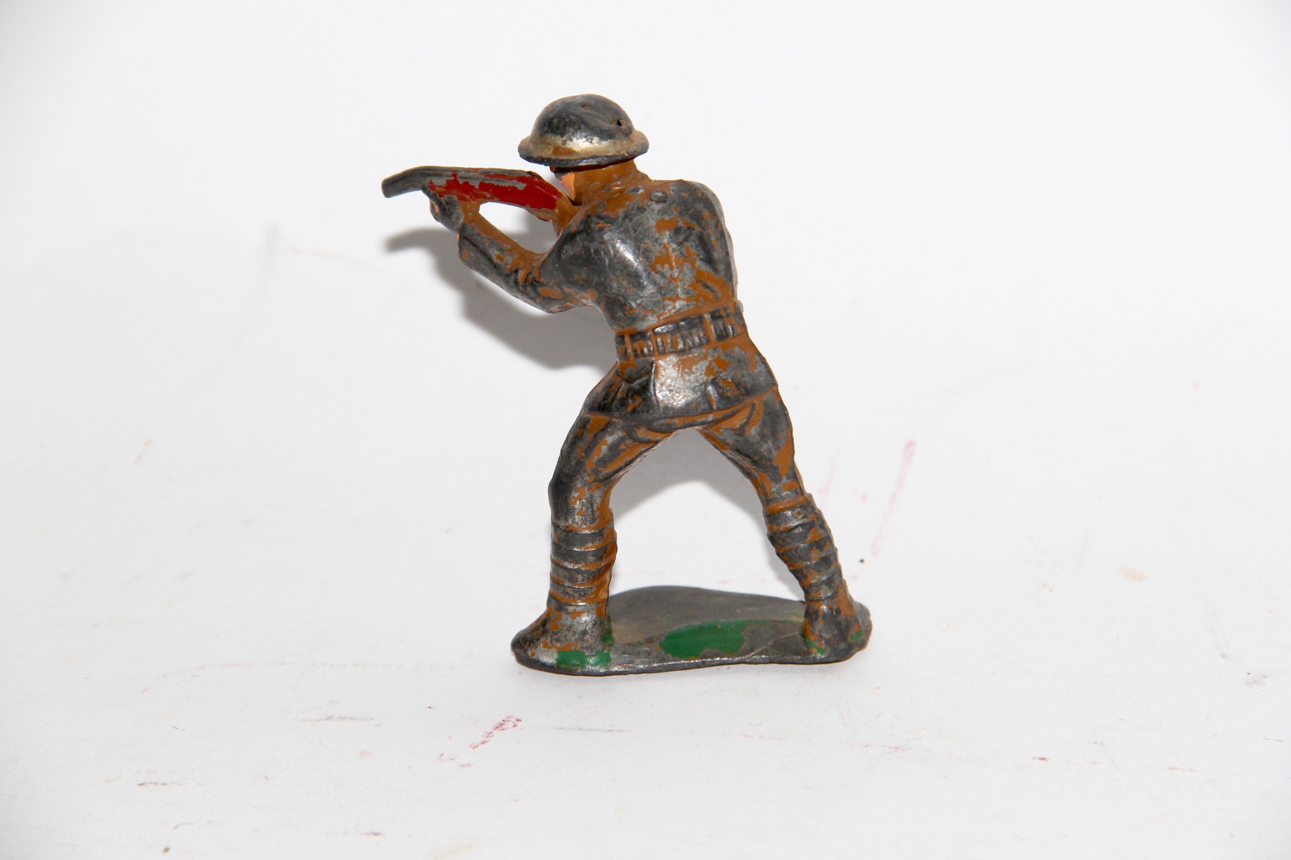 Four Vintage Metal Toy Soldiers