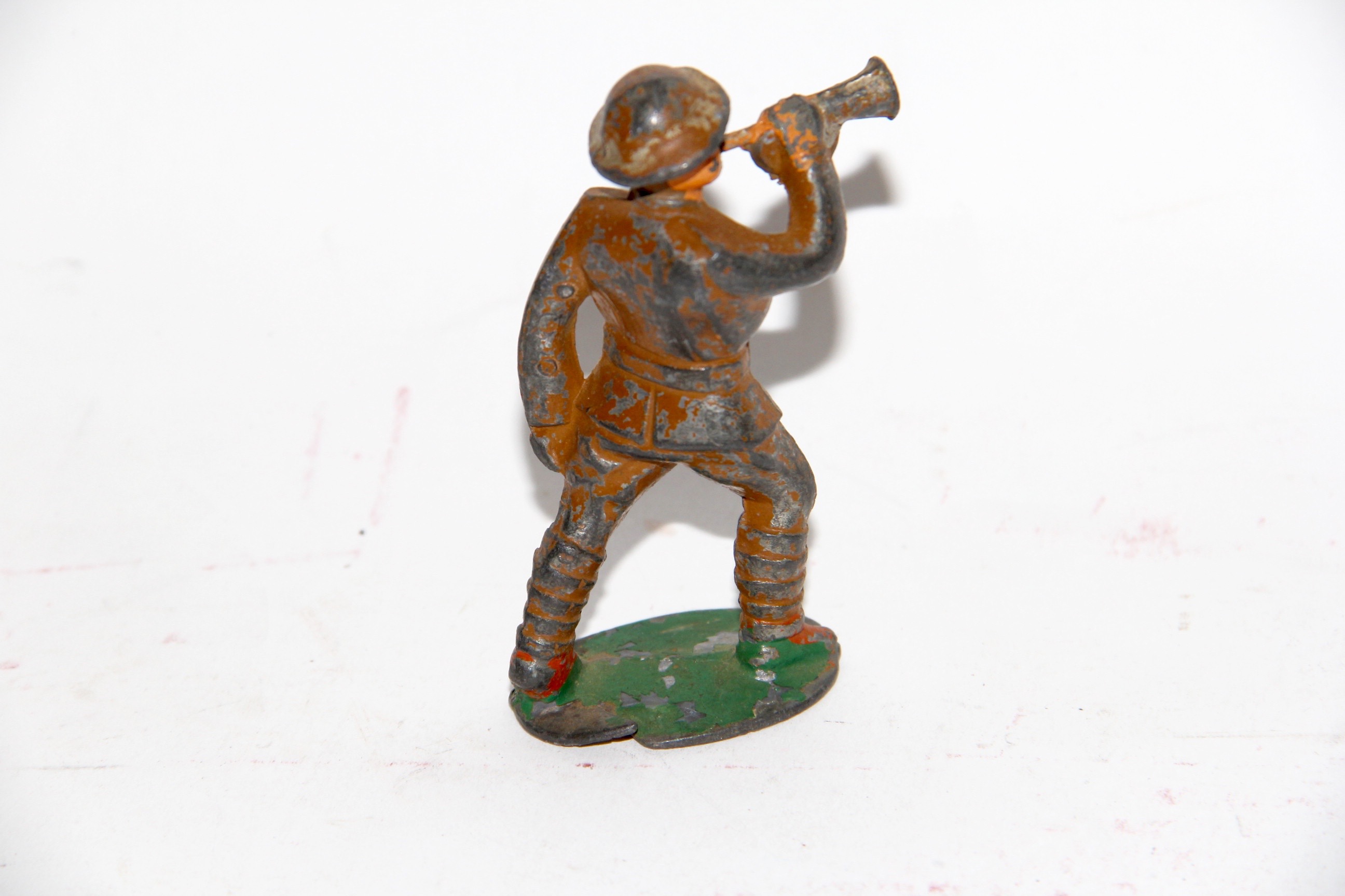 Four Vintage Metal Toy Soldiers