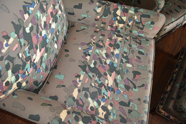 Pair of Gray Confetti Upholstered Armchairs and Ottoman