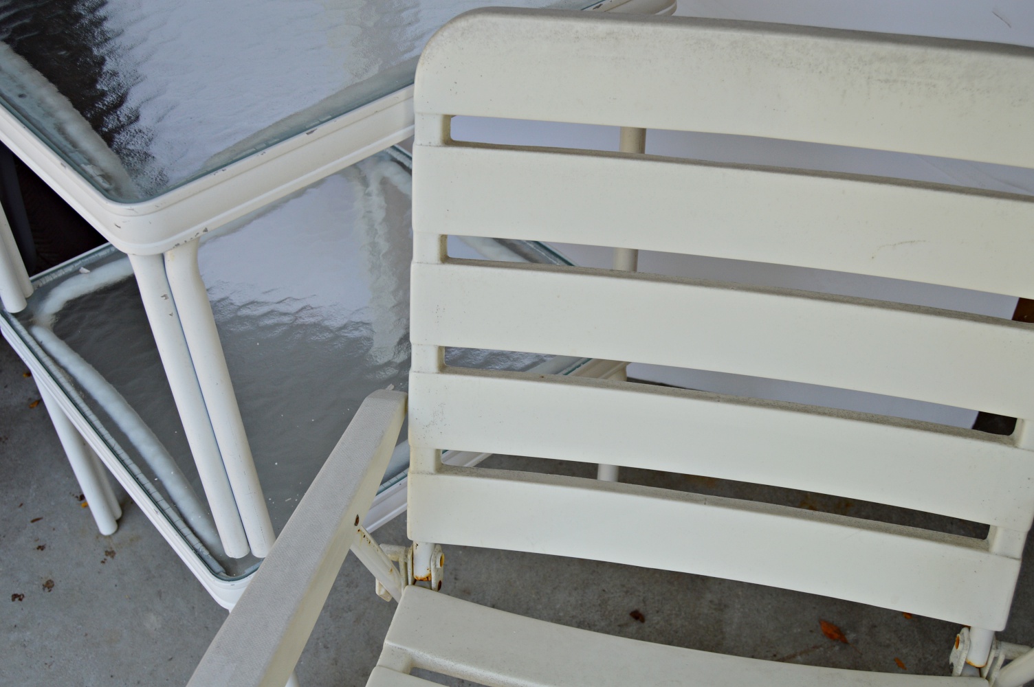 Pair of White Metal and Glass Top Patio Tables and Folding Chair