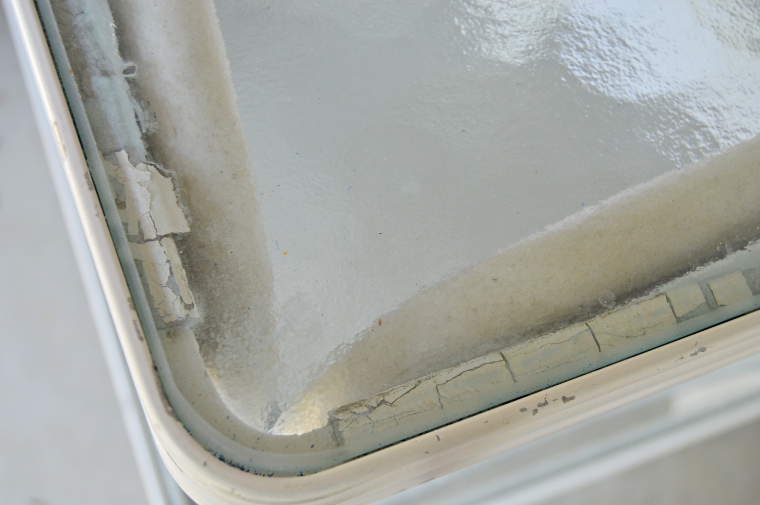 Pair of White Metal and Glass Top Patio Tables and Folding Chair