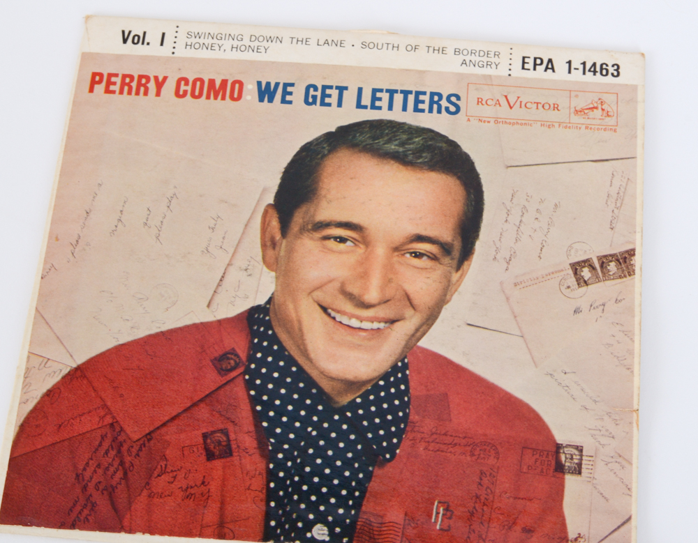 Vintage Rock and Pop 45 rpm Records With Storage Case