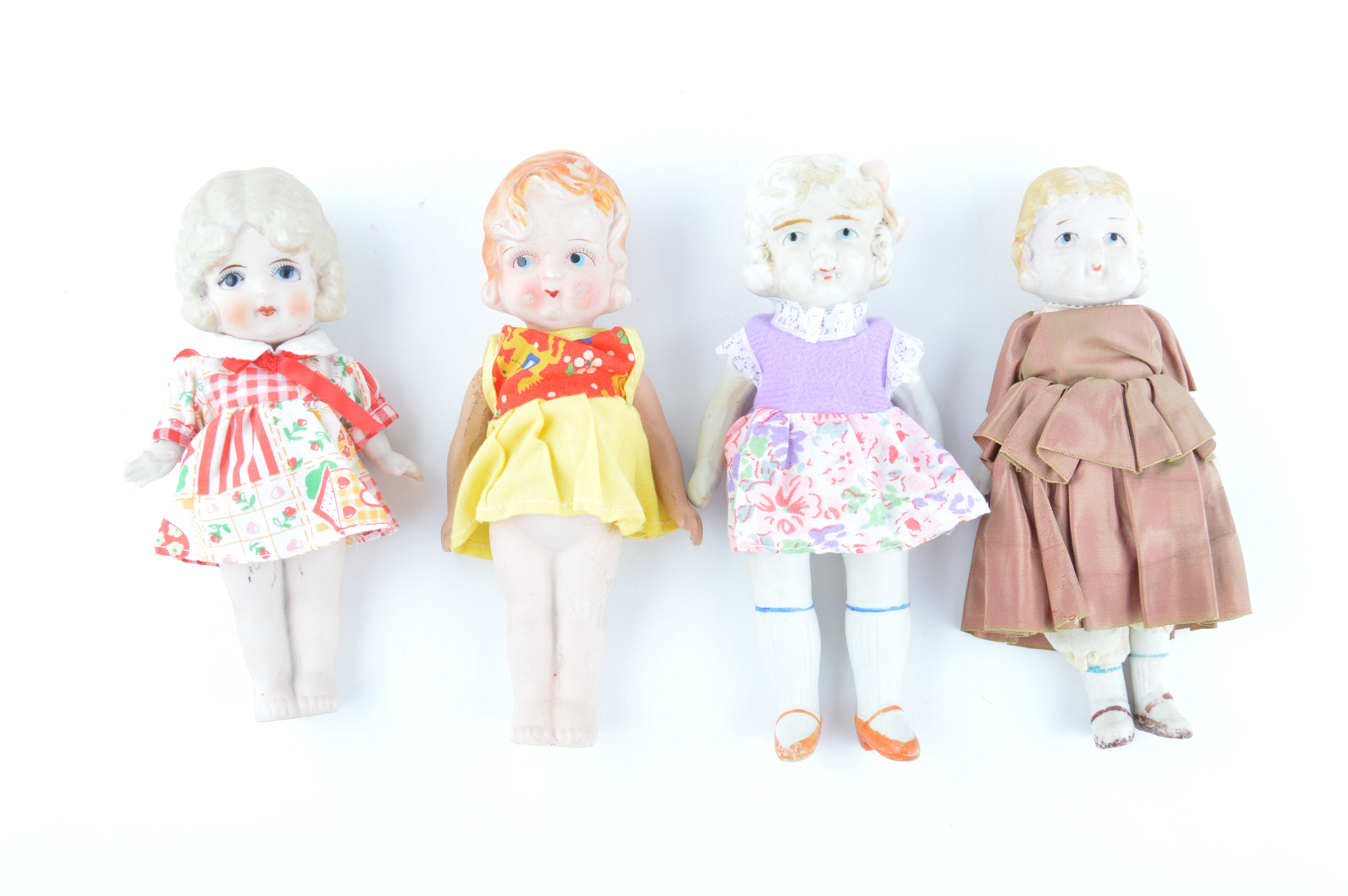Four Vintage Japanese Bisque Porcelain Dolls with Dresses