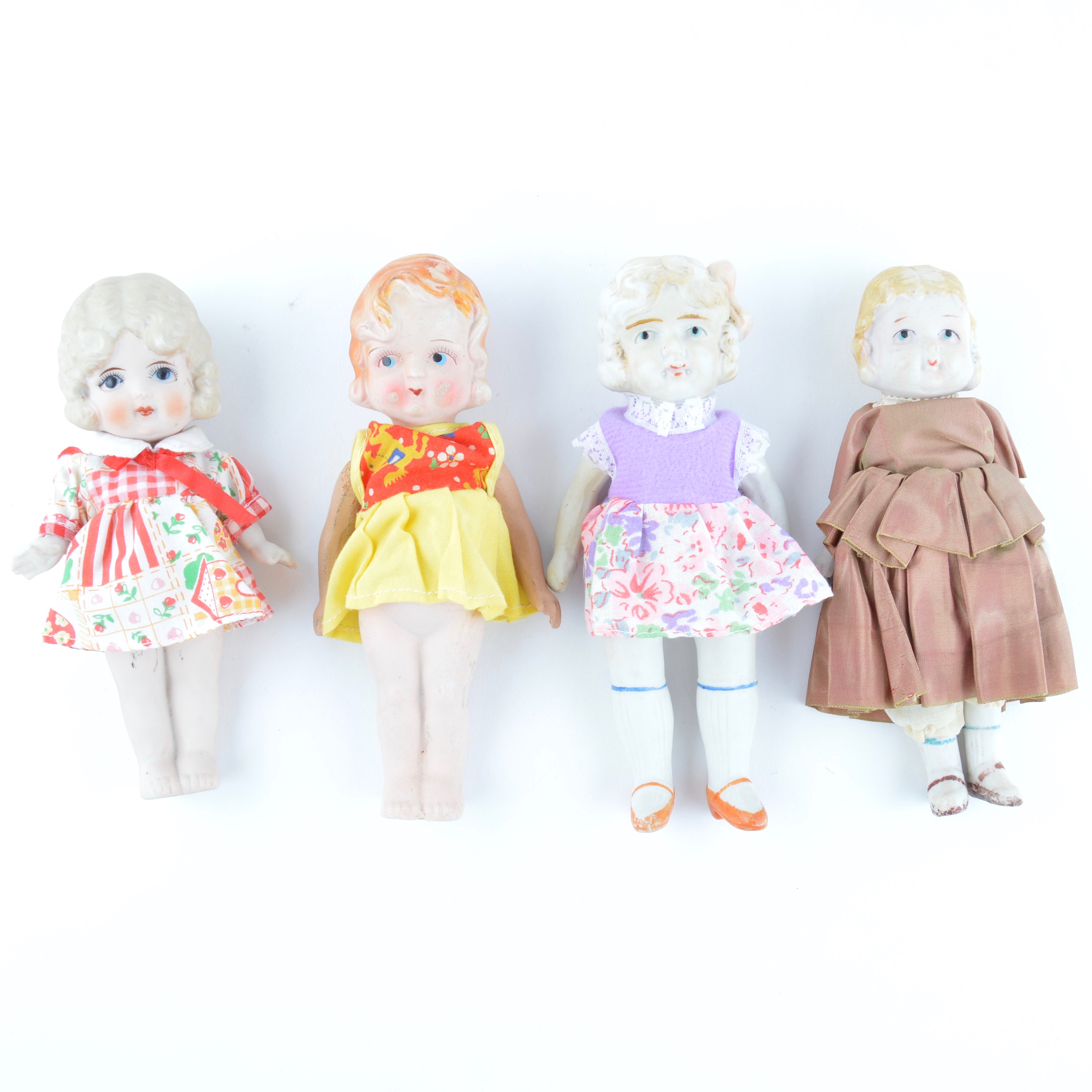 Four Vintage Japanese Bisque Porcelain Dolls with Dresses