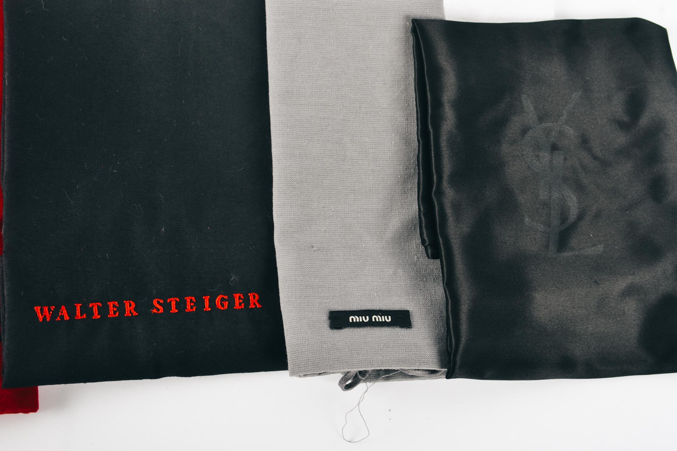 Assortment of Nine Designer Dust Bags Including Prada,Miu Miu and More