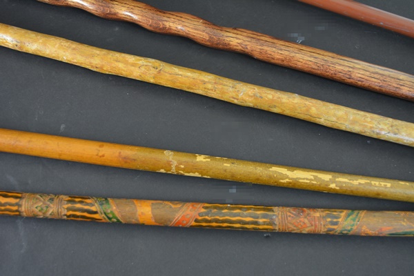 Four Wood Walking Sticks and One Aluminum Walking Stick