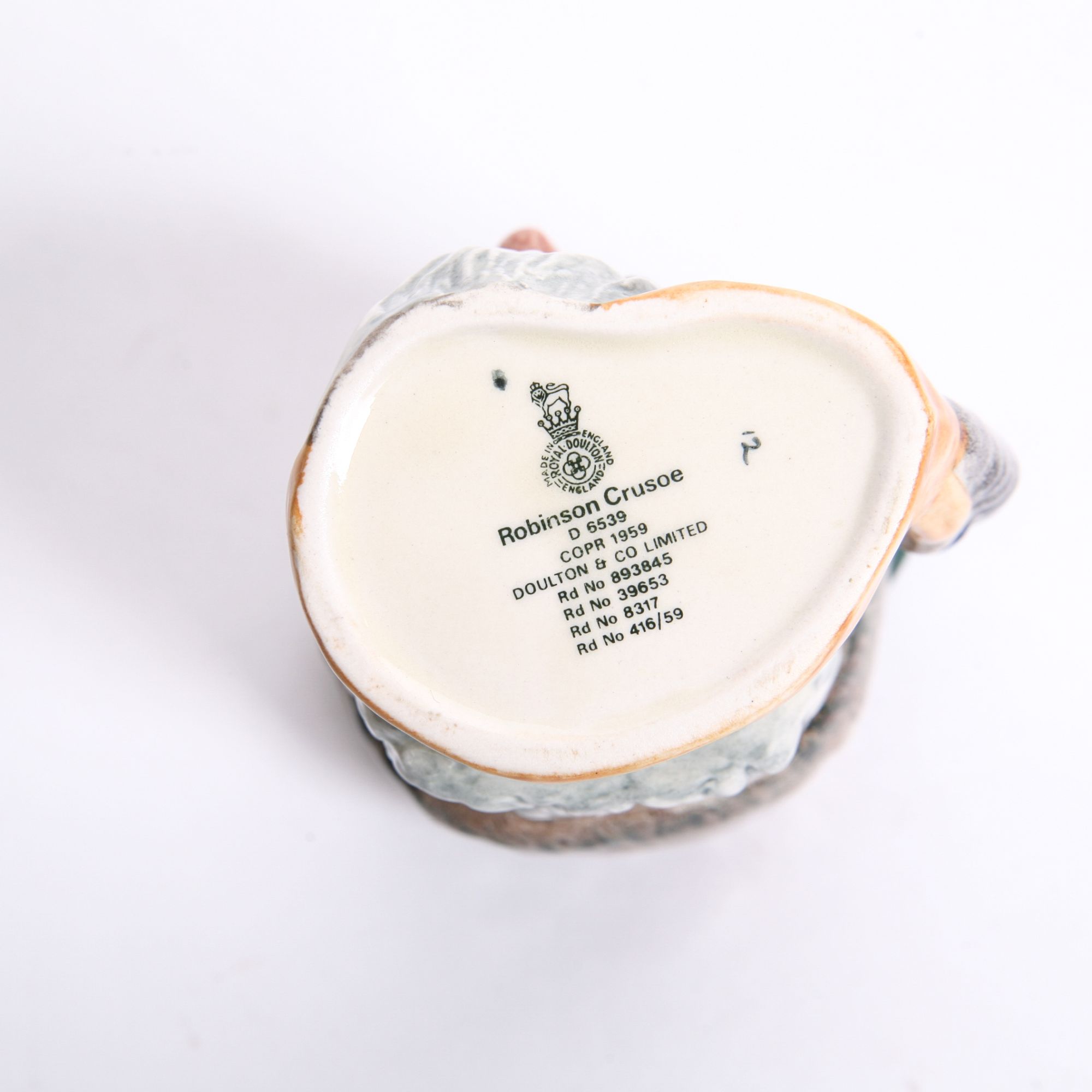 Royal Doulton "Robinson Crusoe" D.6532 Toby Jug and D.6539 Mug